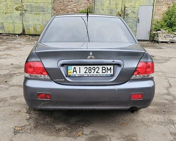 Сірий Міцубісі Lancer, об'ємом двигуна 1.58 л та пробігом 200 тис. км за 1700 $, фото 4 на Automoto.ua