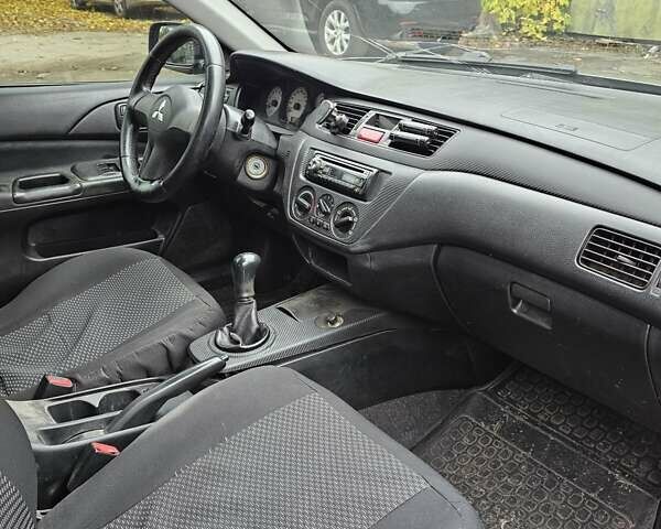 Сірий Міцубісі Lancer, об'ємом двигуна 1.58 л та пробігом 200 тис. км за 1700 $, фото 11 на Automoto.ua