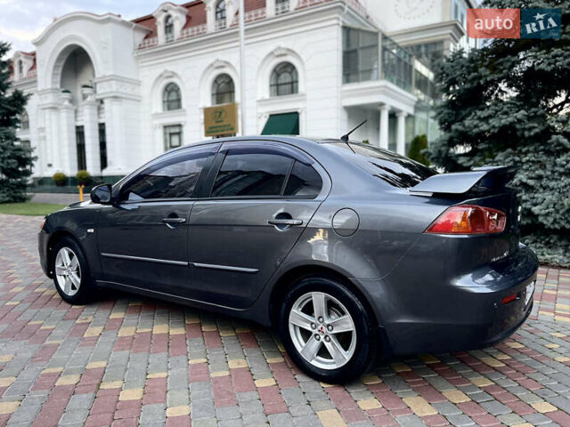 Серый Мицубиси Лансер, объемом двигателя 2 л и пробегом 212 тыс. км за 6000 $, фото 5 на Automoto.ua