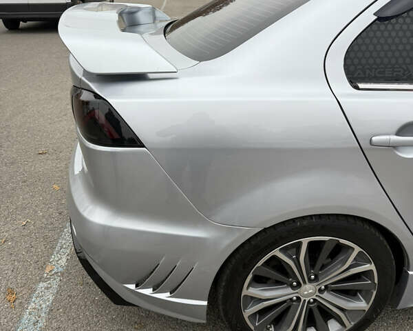 Сірий Міцубісі Lancer, об'ємом двигуна 2 л та пробігом 253 тис. км за 8700 $, фото 19 на Automoto.ua