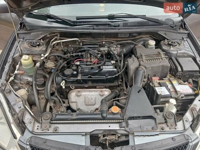 Серый Мицубиси Лансер, объемом двигателя 1.58 л и пробегом 205 тыс. км за 3300 $, фото 11 на Automoto.ua