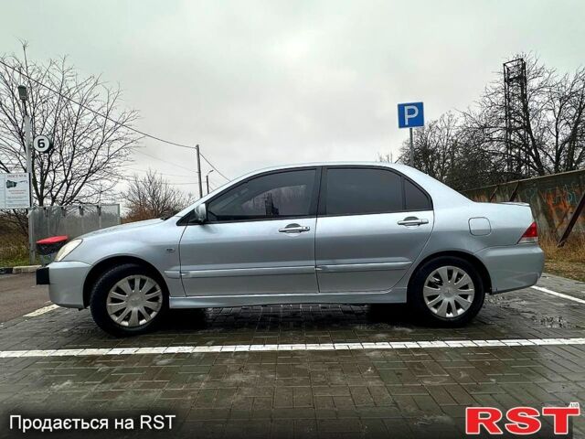 Серый Мицубиси Лансер, объемом двигателя 1.6 л и пробегом 165 тыс. км за 4000 $, фото 11 на Automoto.ua