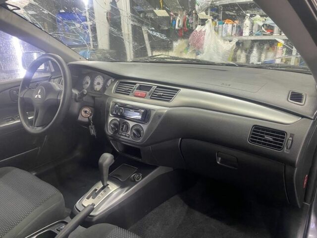 Серый Мицубиси Лансер, объемом двигателя 1.6 л и пробегом 100 тыс. км за 2500 $, фото 3 на Automoto.ua