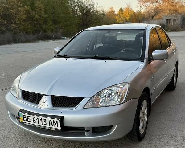 Серый Мицубиси Лансер, объемом двигателя 1.58 л и пробегом 145 тыс. км за 4800 $, фото 6 на Automoto.ua