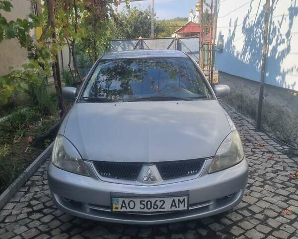 Сірий Міцубісі Lancer, об'ємом двигуна 1.6 л та пробігом 290 тис. км за 3850 $, фото 15 на Automoto.ua