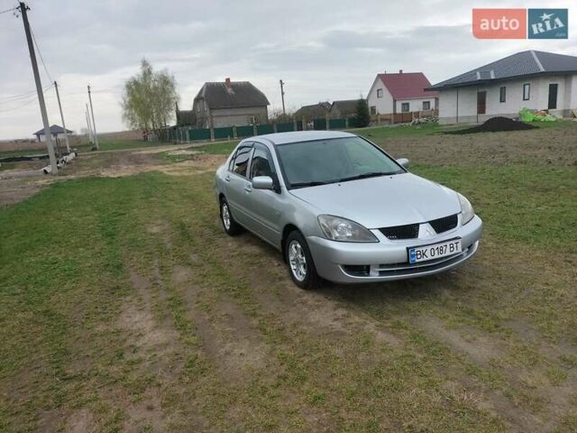 Сірий Міцубісі Lancer, об'ємом двигуна 1.6 л та пробігом 174 тис. км за 4100 $, фото 3 на Automoto.ua