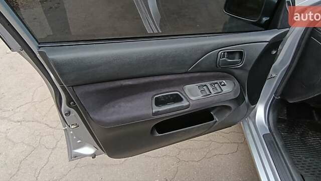 Серый Мицубиси Лансер, объемом двигателя 1.58 л и пробегом 176 тыс. км за 5000 $, фото 23 на Automoto.ua