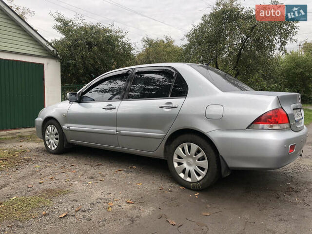 Сірий Міцубісі Lancer, об'ємом двигуна 1.58 л та пробігом 240 тис. км за 4299 $, фото 7 на Automoto.ua
