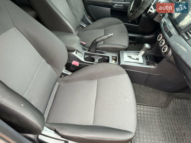 Сірий Міцубісі Lancer, об'ємом двигуна 2 л та пробігом 92 тис. км за 8200 $, фото 32 на Automoto.ua