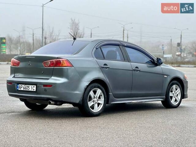 Серый Мицубиси Лансер, объемом двигателя 2 л и пробегом 203 тыс. км за 4999 $, фото 5 на Automoto.ua