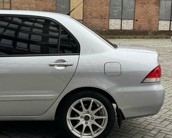 Сірий Міцубісі Lancer, об'ємом двигуна 1.6 л та пробігом 269 тис. км за 3999 $, фото 9 на Automoto.ua