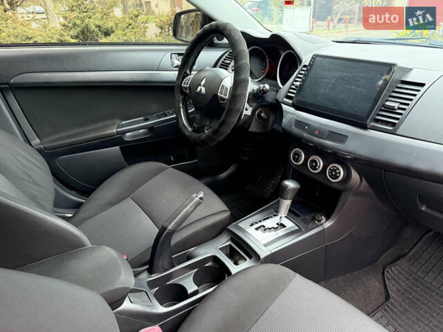 Сірий Міцубісі Lancer, об'ємом двигуна 2 л та пробігом 92 тис. км за 8200 $, фото 33 на Automoto.ua