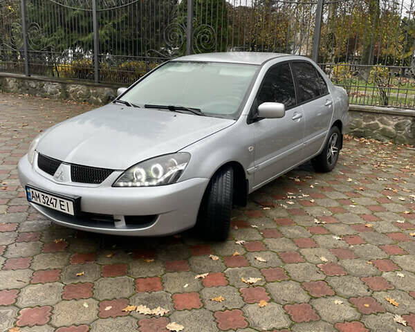 Сірий Міцубісі Lancer, об'ємом двигуна 1.59 л та пробігом 219 тис. км за 4500 $, фото 9 на Automoto.ua