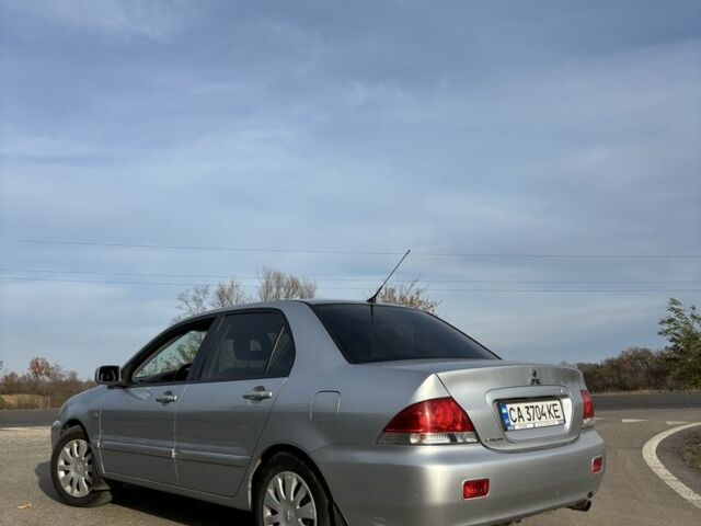 Серый Мицубиси Лансер, объемом двигателя 1.6 л и пробегом 228 тыс. км за 4500 $, фото 3 на Automoto.ua