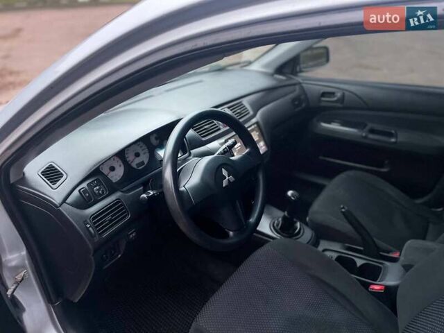 Сірий Міцубісі Lancer, об'ємом двигуна 1.6 л та пробігом 254 тис. км за 3800 $, фото 18 на Automoto.ua
