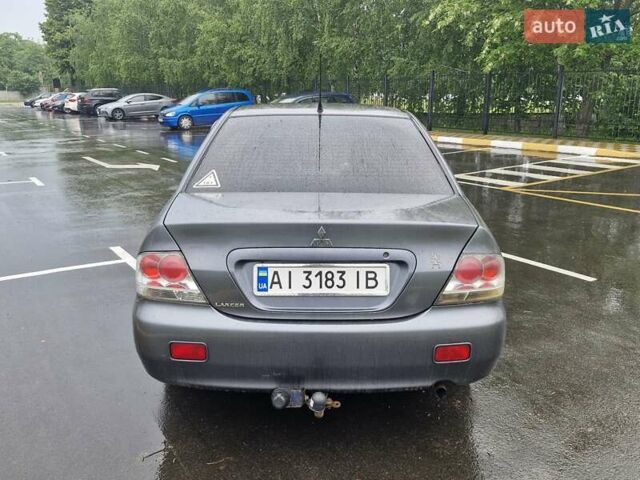 Сірий Міцубісі Lancer, об'ємом двигуна 1.58 л та пробігом 245 тис. км за 2650 $, фото 6 на Automoto.ua