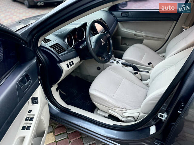 Серый Мицубиси Лансер, объемом двигателя 2 л и пробегом 212 тыс. км за 6000 $, фото 20 на Automoto.ua