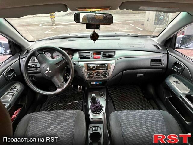 Серый Мицубиси Лансер, объемом двигателя 1.6 л и пробегом 165 тыс. км за 4000 $, фото 5 на Automoto.ua
