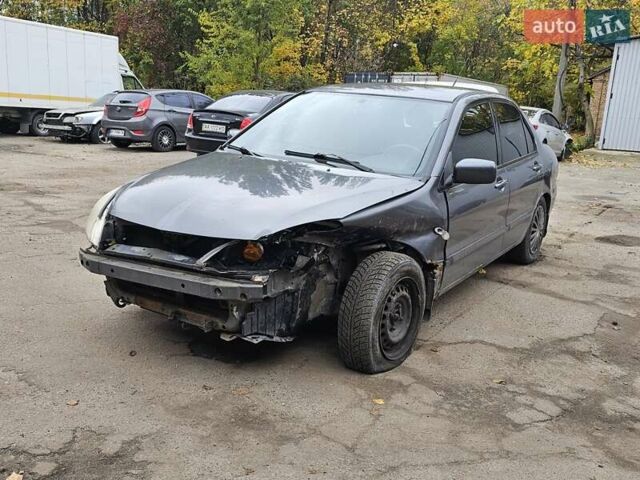 Сірий Міцубісі Lancer, об'ємом двигуна 1.58 л та пробігом 200 тис. км за 1700 $, фото 2 на Automoto.ua