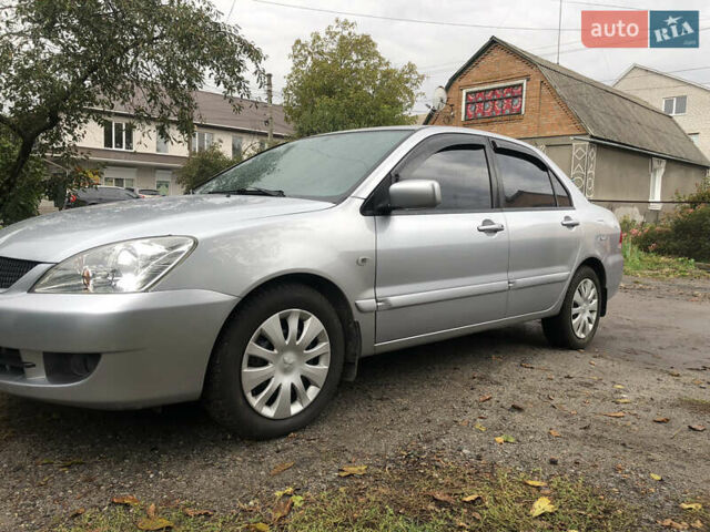 Сірий Міцубісі Lancer, об'ємом двигуна 1.58 л та пробігом 240 тис. км за 4299 $, фото 11 на Automoto.ua