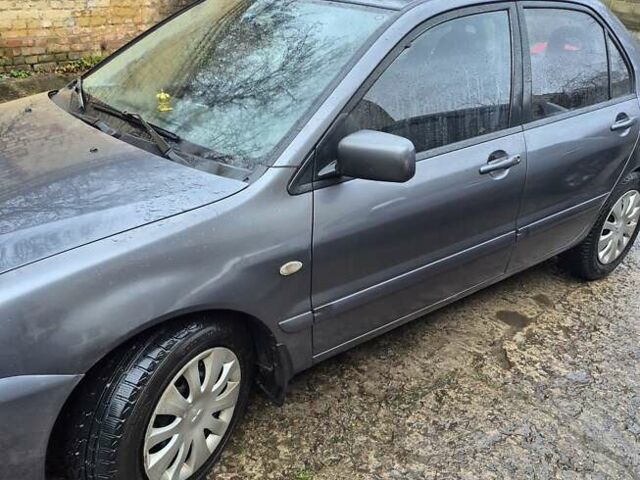 Сірий Міцубісі Lancer, об'ємом двигуна 1.6 л та пробігом 230 тис. км за 4400 $, фото 1 на Automoto.ua