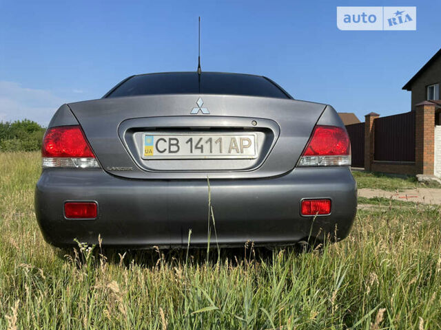 Сірий Міцубісі Lancer, об'ємом двигуна 1.6 л та пробігом 165 тис. км за 5200 $, фото 3 на Automoto.ua