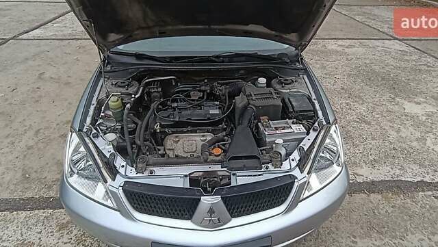Сірий Міцубісі Lancer, об'ємом двигуна 1.6 л та пробігом 176 тис. км за 4999 $, фото 31 на Automoto.ua
