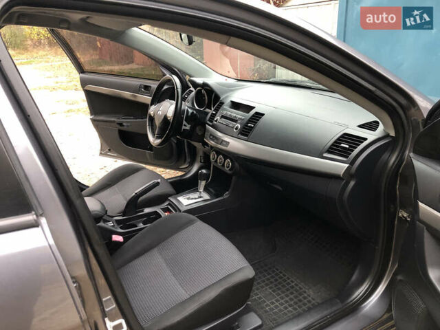 Сірий Міцубісі Lancer, об'ємом двигуна 2 л та пробігом 187 тис. км за 8000 $, фото 25 на Automoto.ua