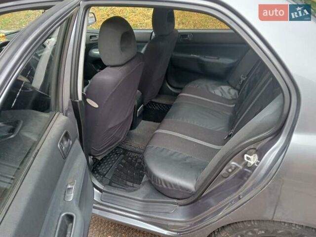 Серый Мицубиси Лансер, объемом двигателя 1.58 л и пробегом 205 тыс. км за 3300 $, фото 8 на Automoto.ua