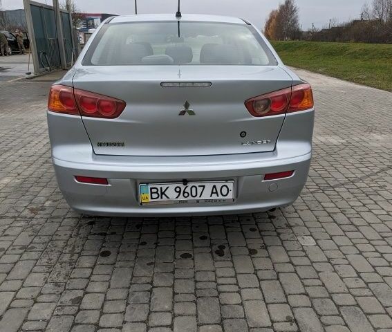 Серый Мицубиси Лансер, объемом двигателя 1.5 л и пробегом 147 тыс. км за 6700 $, фото 5 на Automoto.ua