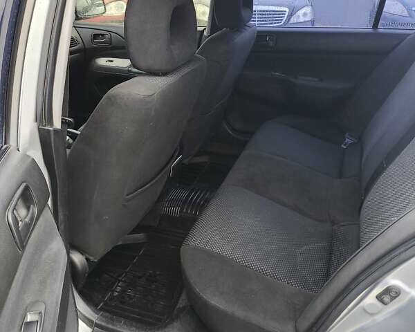 Сірий Міцубісі Lancer, об'ємом двигуна 1.6 л та пробігом 240 тис. км за 2999 $, фото 3 на Automoto.ua