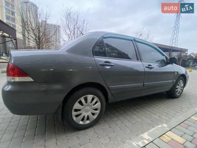 Сірий Міцубісі Lancer, об'ємом двигуна 1.6 л та пробігом 250 тис. км за 3500 $, фото 6 на Automoto.ua