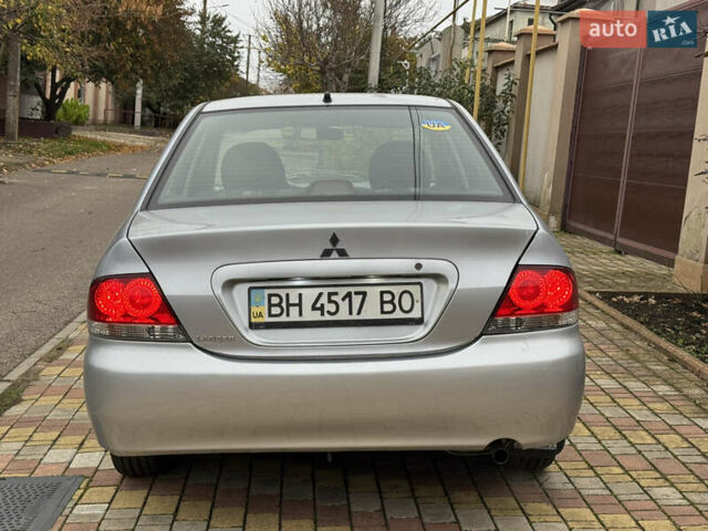 Сірий Міцубісі Lancer, об'ємом двигуна 1.6 л та пробігом 221 тис. км за 3650 $, фото 13 на Automoto.ua