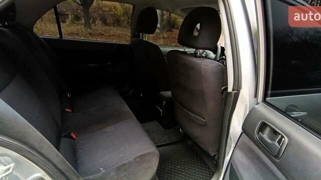 Серый Мицубиси Лансер, объемом двигателя 1.58 л и пробегом 176 тыс. км за 5000 $, фото 13 на Automoto.ua