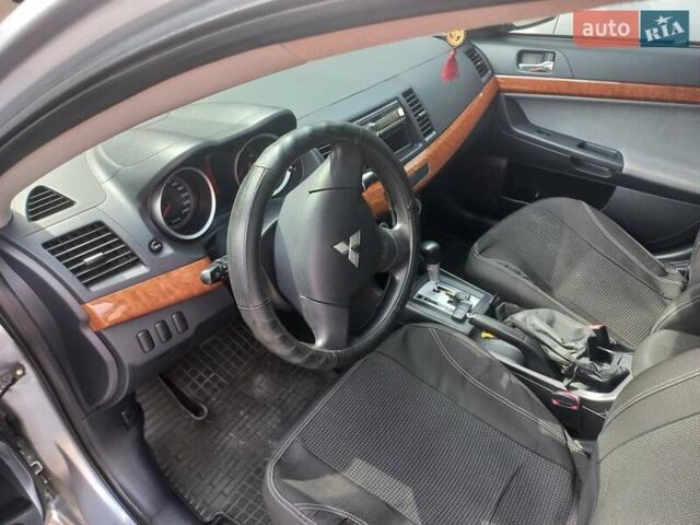 Серый Мицубиси Лансер, объемом двигателя 2 л и пробегом 103 тыс. км за 7700 $, фото 14 на Automoto.ua