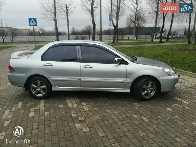 Сірий Міцубісі Lancer, об'ємом двигуна 1.6 л та пробігом 225 тис. км за 5200 $, фото 5 на Automoto.ua
