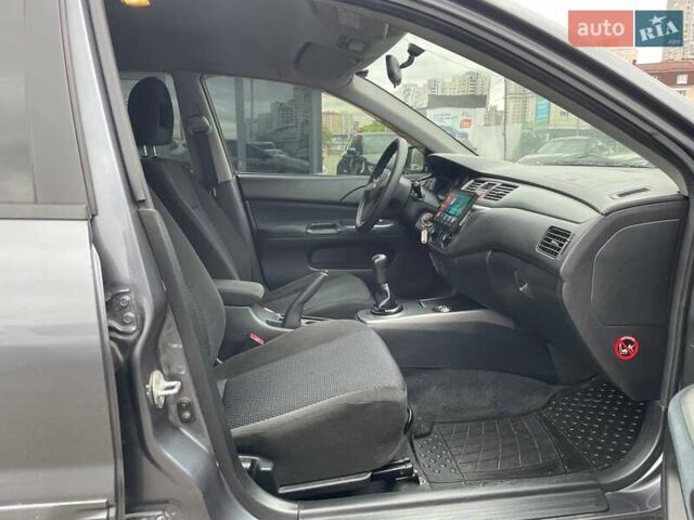 Серый Мицубиси Лансер, объемом двигателя 1.58 л и пробегом 146 тыс. км за 5490 $, фото 11 на Automoto.ua