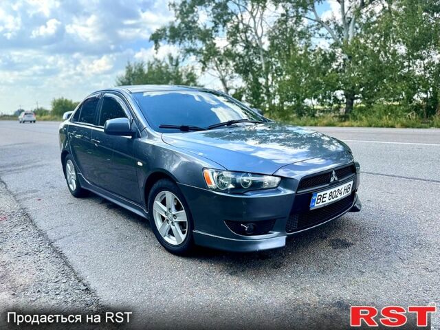 Серый Мицубиси Лансер, объемом двигателя 2 л и пробегом 250 тыс. км за 5800 $, фото 1 на Automoto.ua