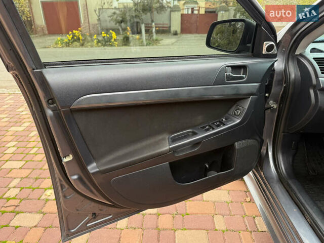 Сірий Міцубісі Lancer, об'ємом двигуна 2 л та пробігом 92 тис. км за 8200 $, фото 25 на Automoto.ua