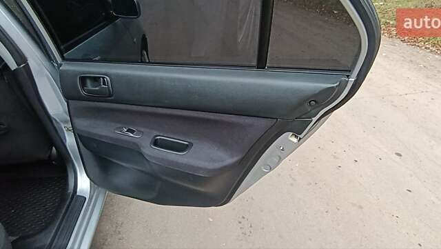 Серый Мицубиси Лансер, объемом двигателя 1.58 л и пробегом 176 тыс. км за 5000 $, фото 14 на Automoto.ua