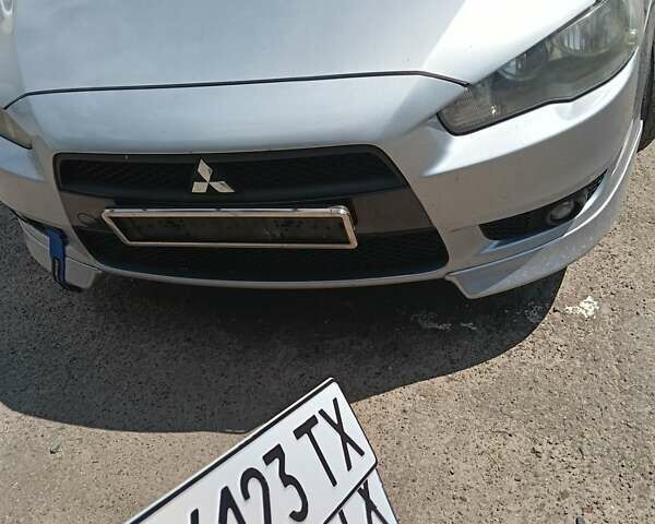 Серый Мицубиси Лансер, объемом двигателя 2 л и пробегом 250 тыс. км за 5400 $, фото 1 на Automoto.ua