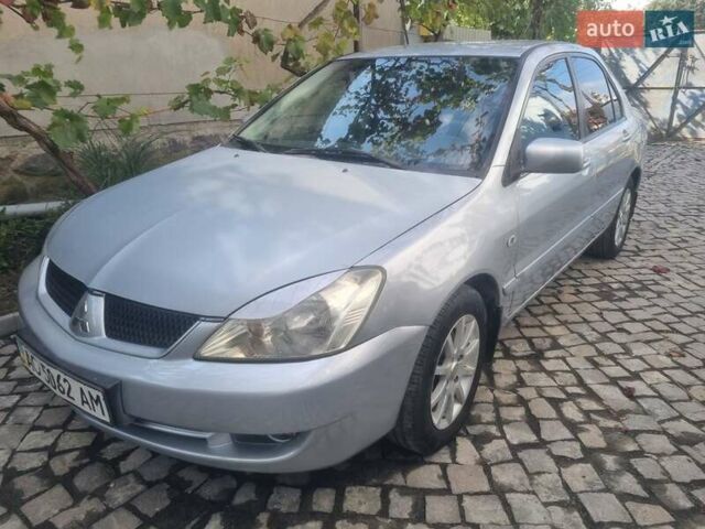 Сірий Міцубісі Lancer, об'ємом двигуна 1.6 л та пробігом 290 тис. км за 3850 $, фото 13 на Automoto.ua