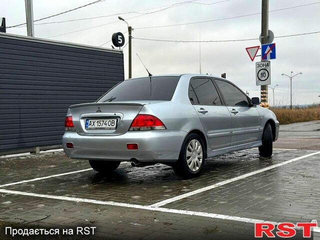 Серый Мицубиси Лансер, объемом двигателя 1.6 л и пробегом 165 тыс. км за 4000 $, фото 1 на Automoto.ua