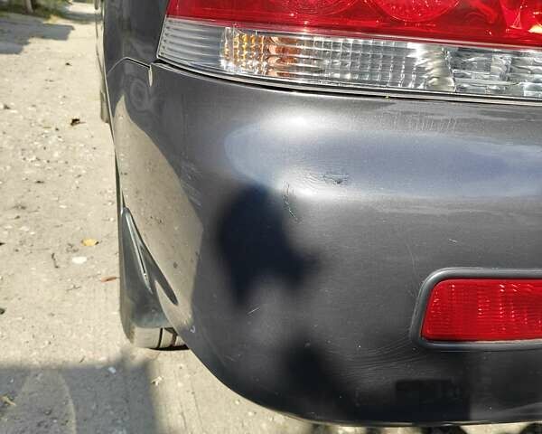 Сірий Міцубісі Lancer, об'ємом двигуна 1.58 л та пробігом 97 тис. км за 6800 $, фото 16 на Automoto.ua