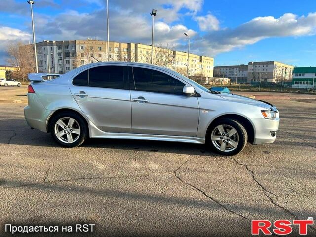 Сірий Міцубісі Lancer, об'ємом двигуна 2 л та пробігом 200 тис. км за 5999 $, фото 6 на Automoto.ua