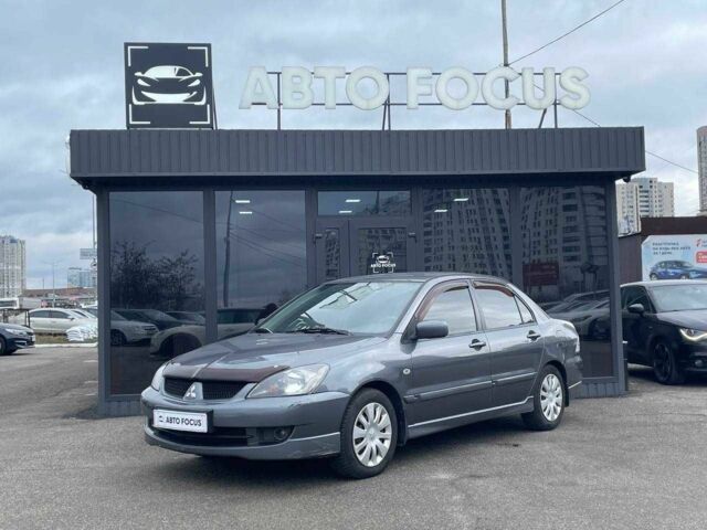 Серый Мицубиси Лансер, объемом двигателя 1.6 л и пробегом 146 тыс. км за 5990 $, фото 3 на Automoto.ua