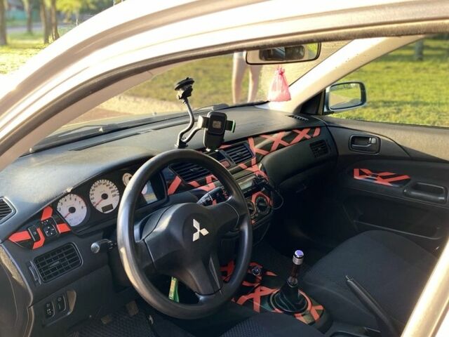 Сірий Міцубісі Lancer, об'ємом двигуна 1.6 л та пробігом 211 тис. км за 3899 $, фото 3 на Automoto.ua