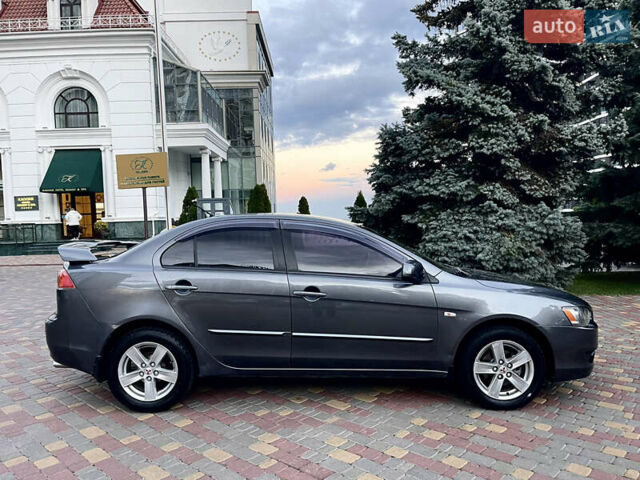 Серый Мицубиси Лансер, объемом двигателя 2 л и пробегом 212 тыс. км за 6000 $, фото 13 на Automoto.ua