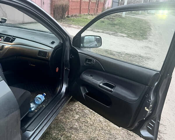 Сірий Міцубісі Lancer, об'ємом двигуна 1.58 л та пробігом 186 тис. км за 3500 $, фото 9 на Automoto.ua