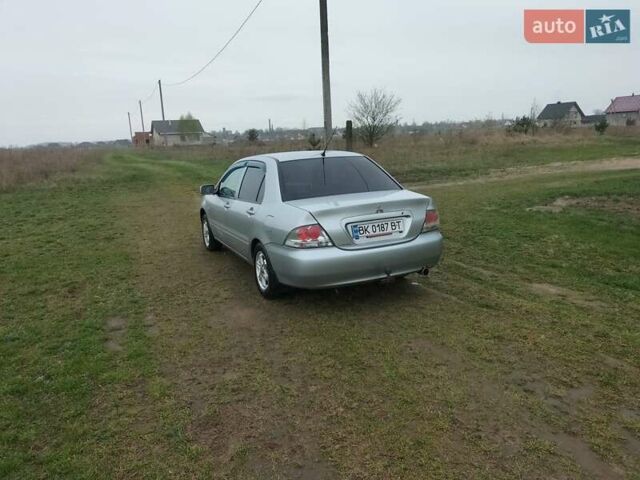 Сірий Міцубісі Lancer, об'ємом двигуна 1.6 л та пробігом 174 тис. км за 4100 $, фото 5 на Automoto.ua